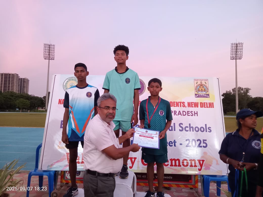 EMRS Ananthagiri volleyball players receiving a certificate at a national Eklavya Model Residential Schools event
